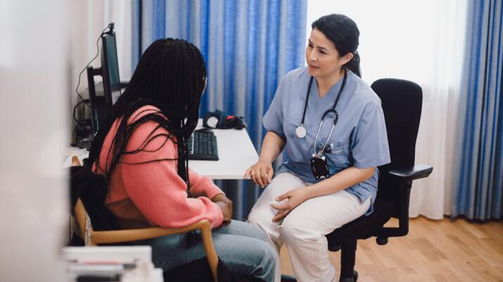 Woman consulting with a doctor