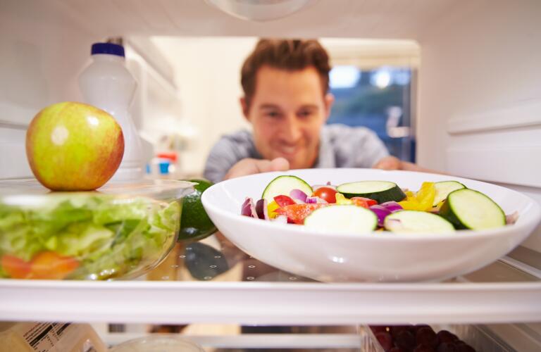 Man opens refrigerator