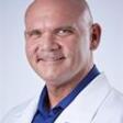 Dr. Maurice Corman, MD