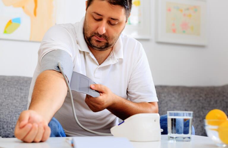 Male taking blood pressure
