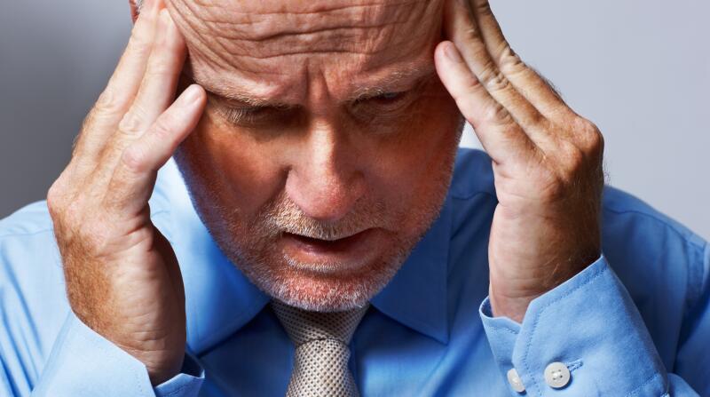 stressed-man-with-hands-on-head
