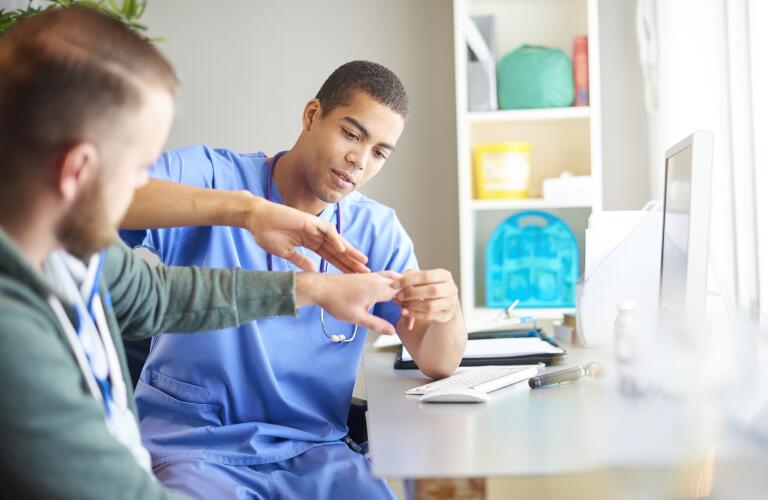 doctor-examining-patients-hand