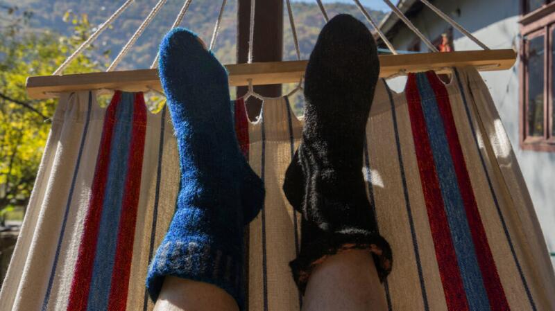 A person's feet in wool socks