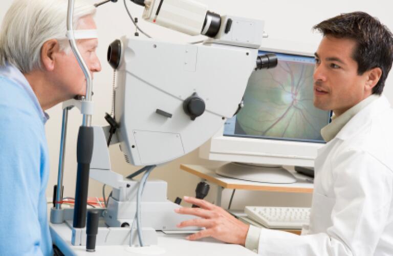 senior receiving eye exam