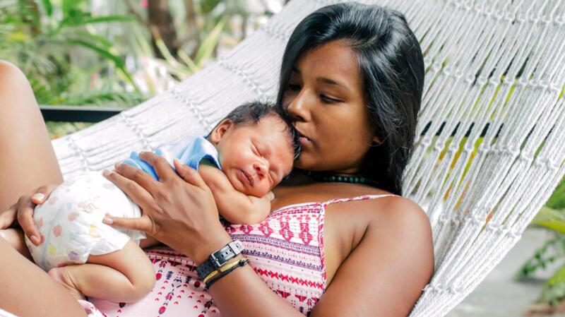 A mother and baby on a hammock