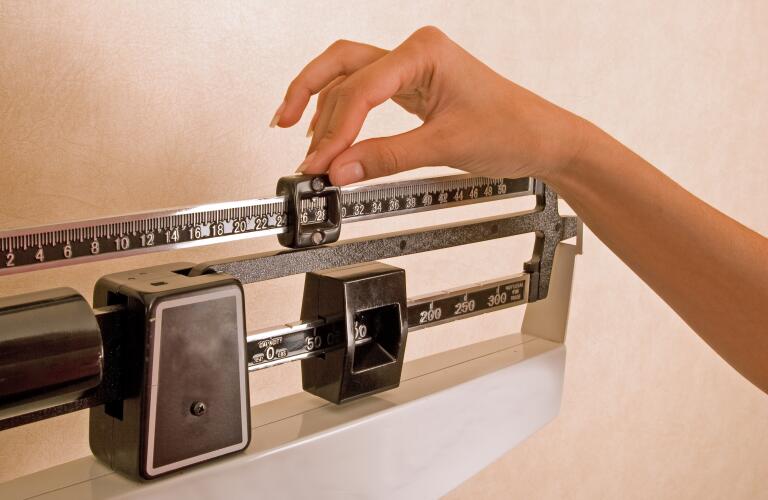 woman-adjusting-scale