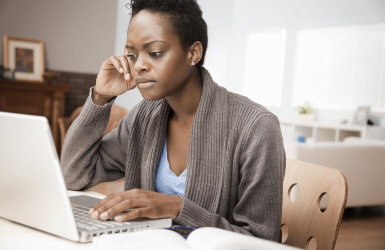 African American woman on computer at home