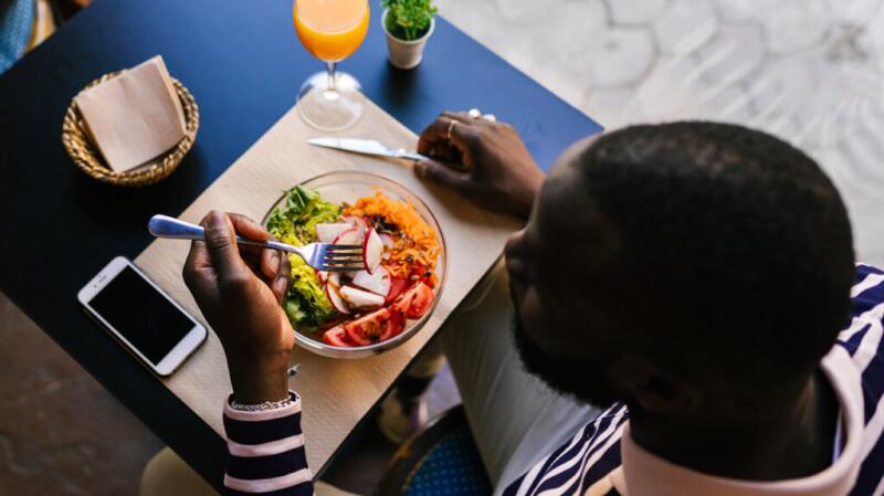 Person eating a salad
