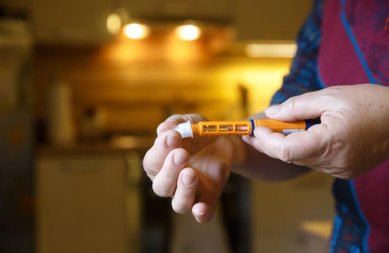 doctor-holding-injection-pen