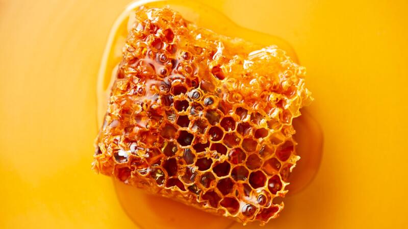 There is honeycomb against a yellow background.