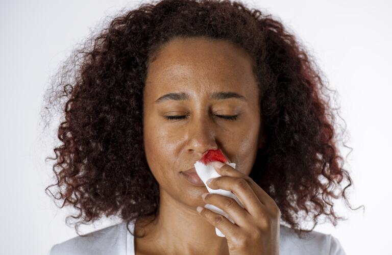 Woman With Nosebleed