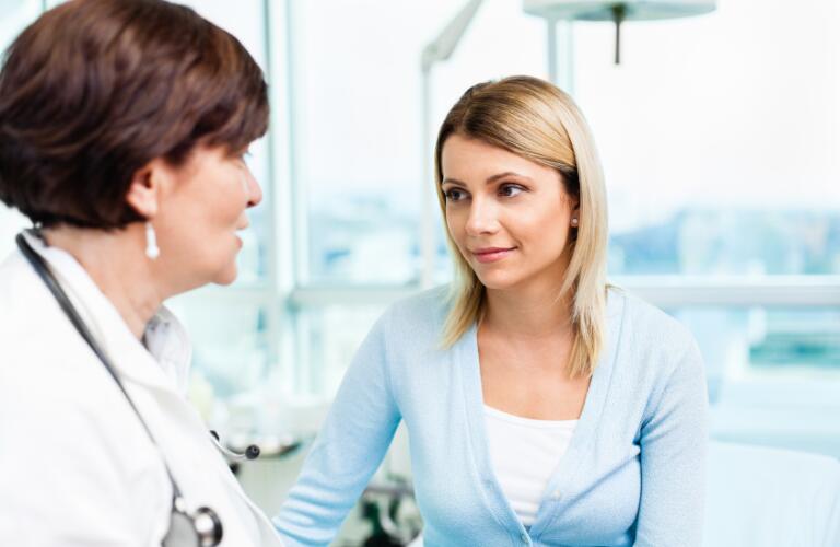 Female doctor talking with female patient