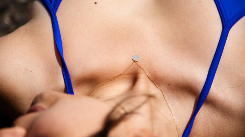 woman wearing heart necklace