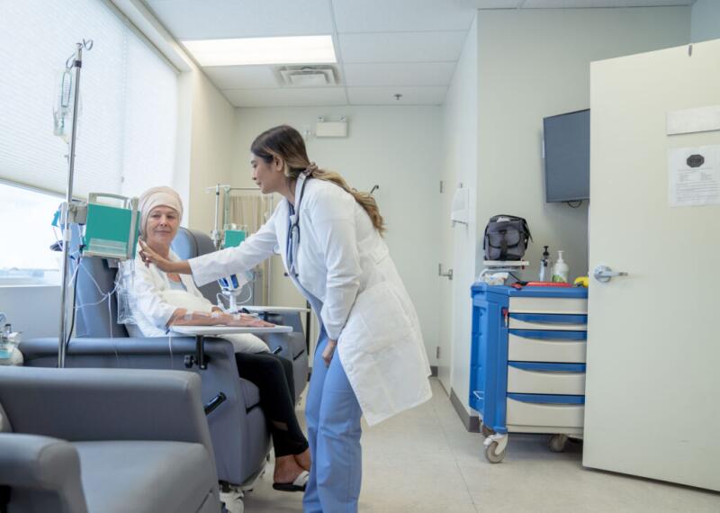 Doctor Changing a Chemotherapy Dosage