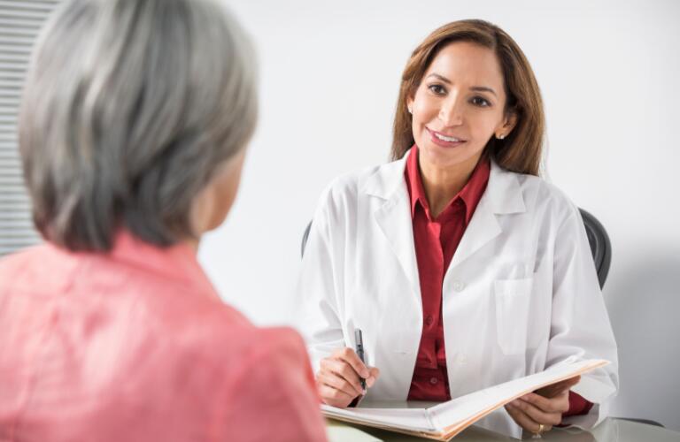 Doctor talking with patient
