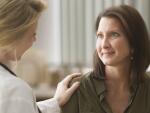 Female doctor talking with patient