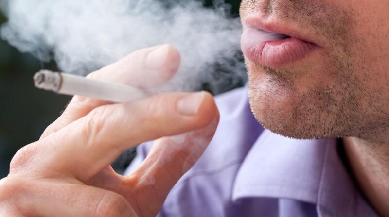 cigarette dark A smoking cigarette over a dark background, low key light Stock Photo cigarette dark A smoking cigarette over a dark background, low key light Stock Photo