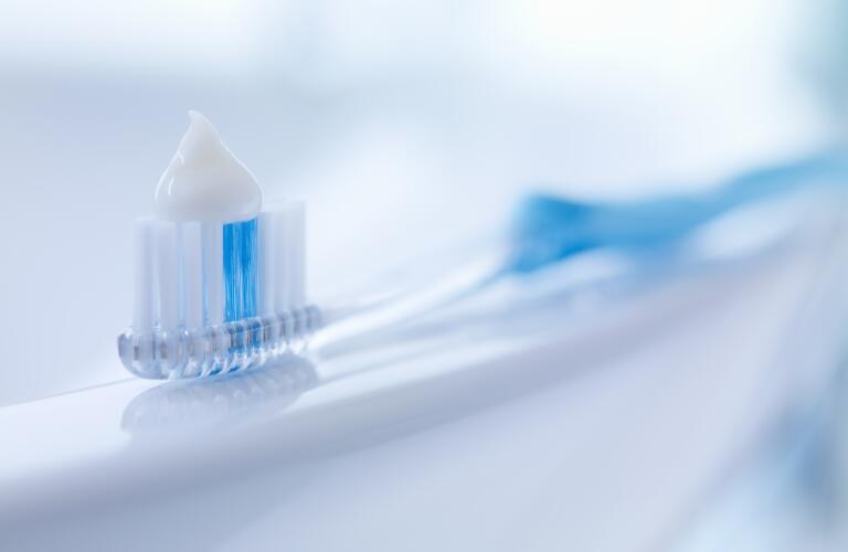 toothpaste on toothbrush