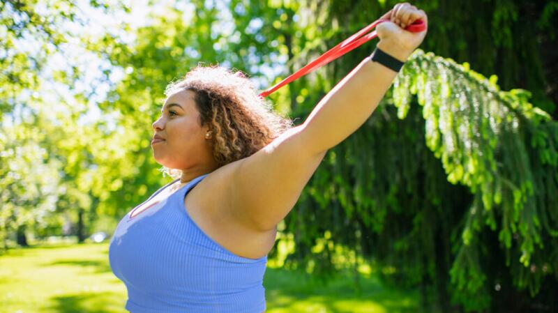 A woman using a workout band