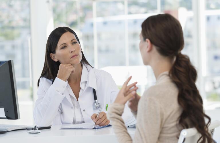 Female doctor discussing with a patient