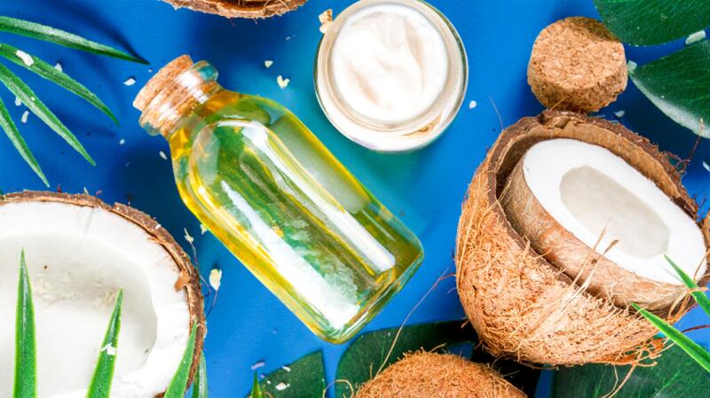 bottle of oil and coconuts