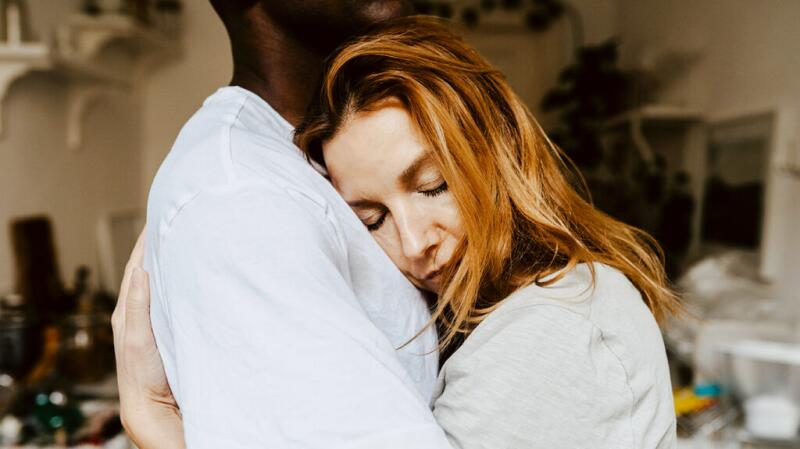 Two people are hugging.