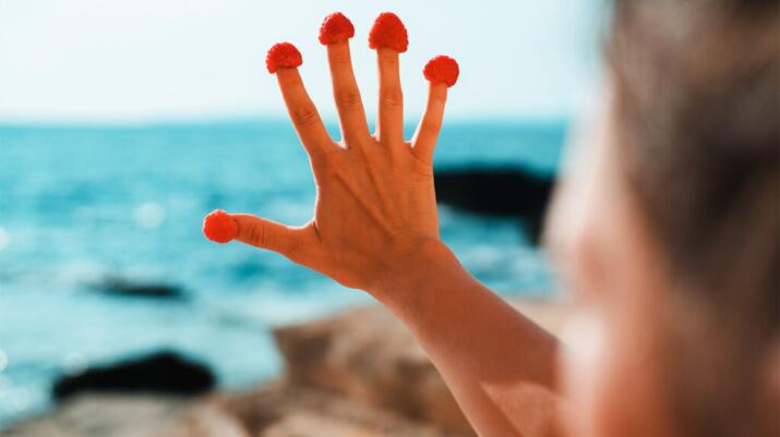 Fingers with berries on the ends