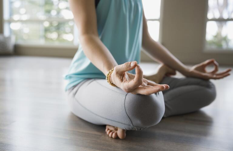 woman-sitting-in-yoga-position