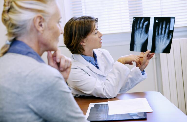 Rheumatology consultation looking at hand x-rays