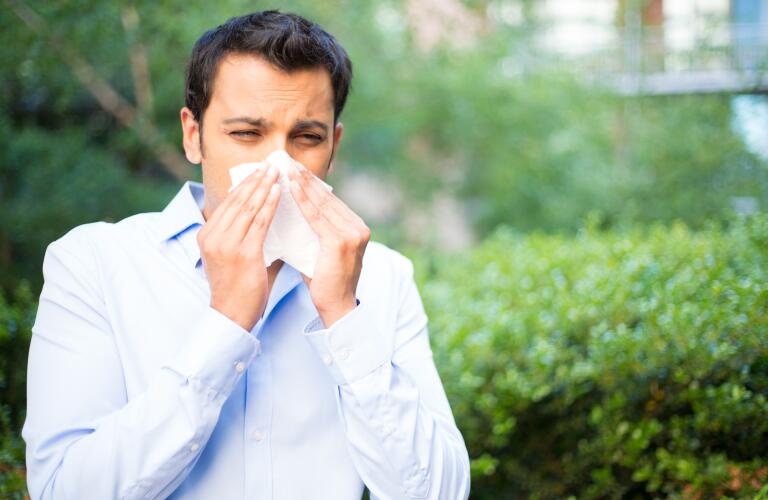 Man blowing nose