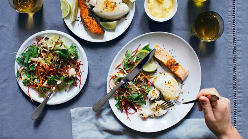 A plate with fish and a salad