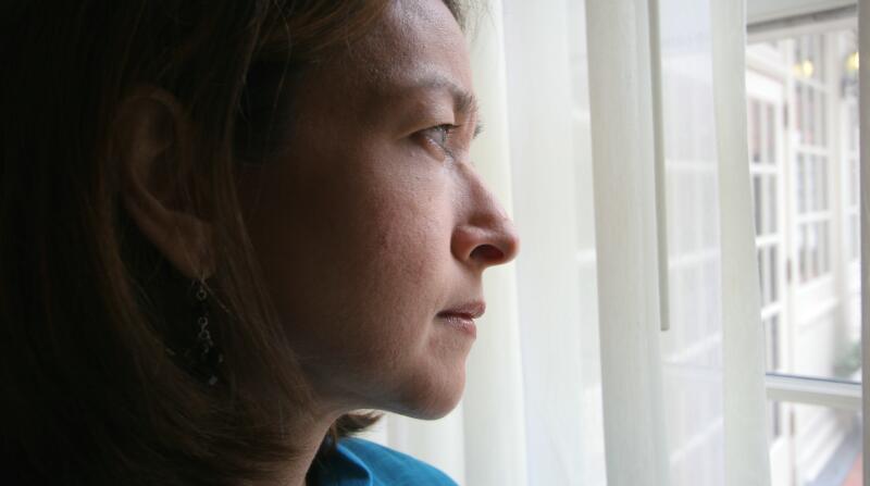 woman look though window