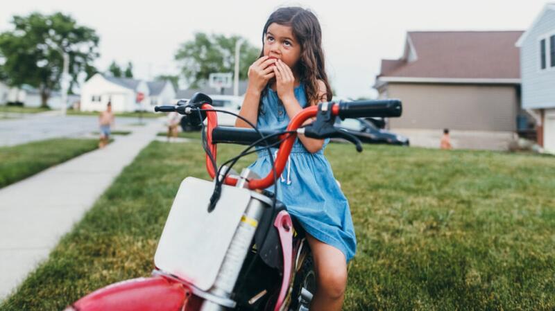 girl on bike eating