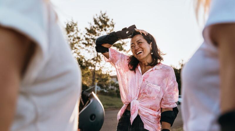 Female on rollerblades, smiling