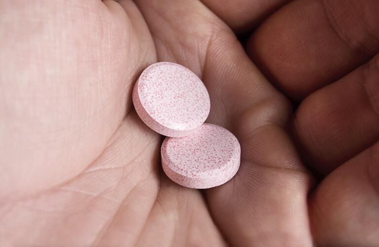 holding oral tablets