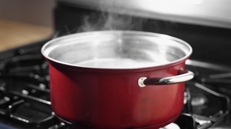 Pot of boiling water on stove top