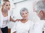 mother and daughter talking to doctor