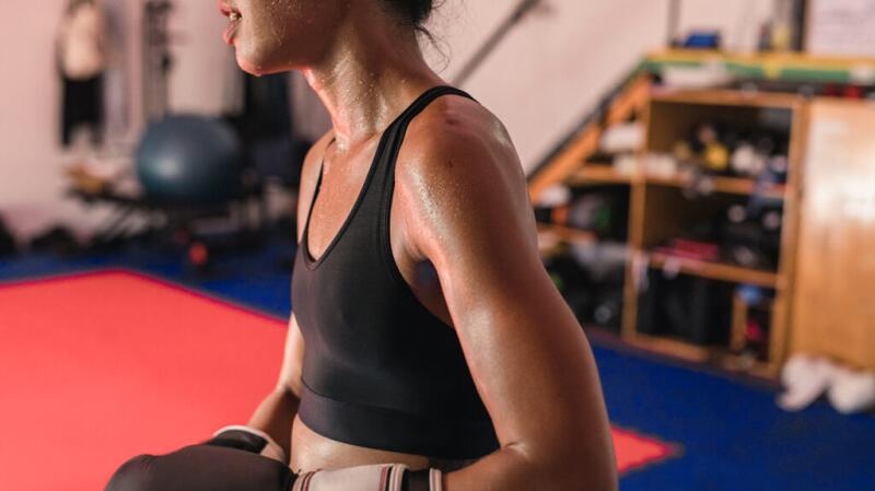 A sweaty person boxing