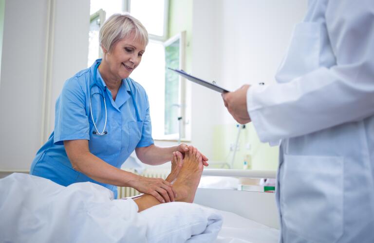 doctor examining patient's foot