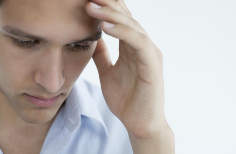 man-with-hand-on-head