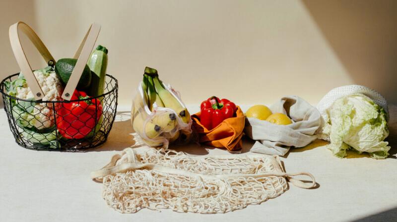 there is a selection of fruits and vegetables on a white table