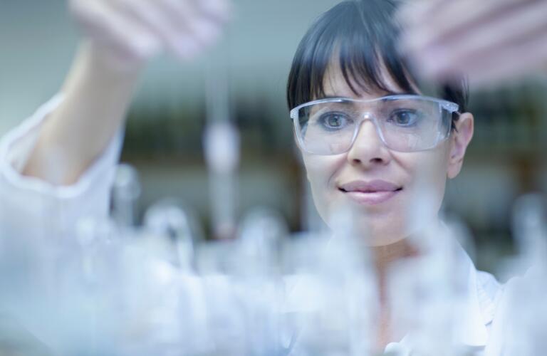 Oenologist mixing during sample testing in laboratory