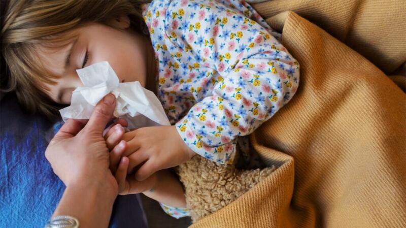 A child blows their nose