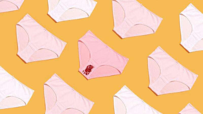 concept of menstruation with red confetti on underwear