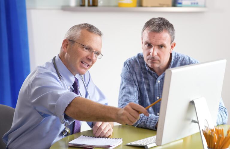 Doctor having discussion with male patient