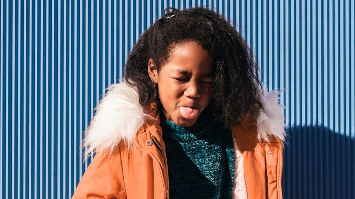 young person sticking tongue out