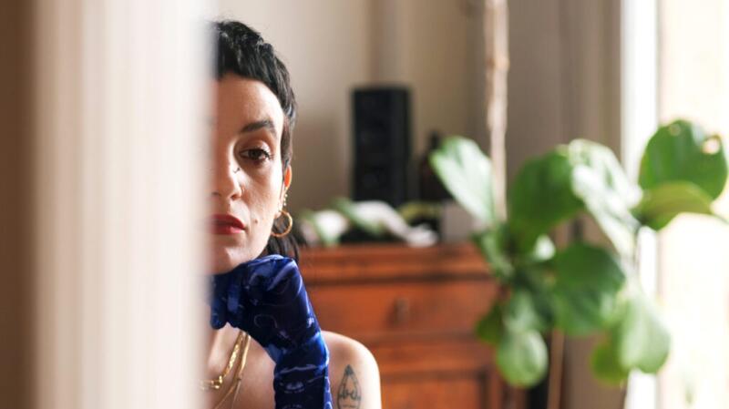 woman looking into mirror