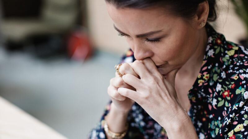 A woman looking upset or serious