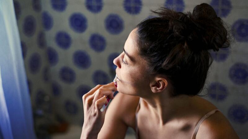 A woman brushing her teeth
