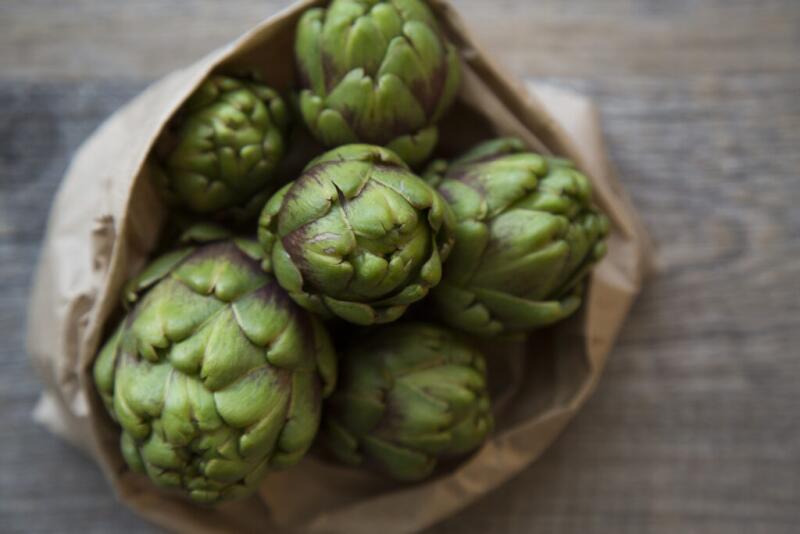 A bag of raw artichokes.